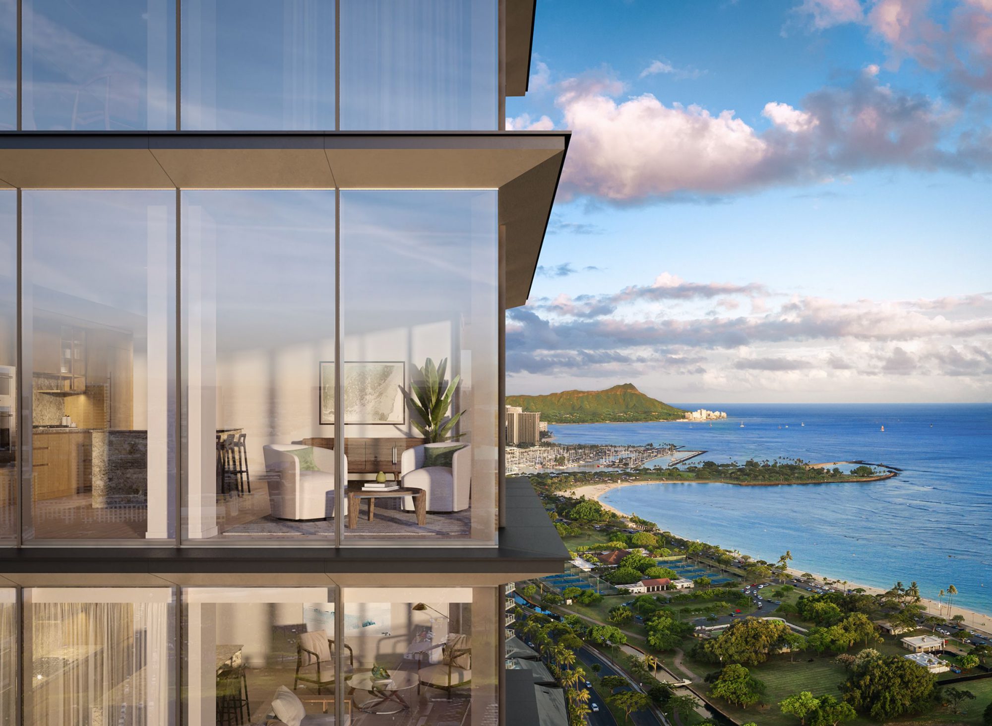 Close-up aerial of Victoria Place, with focus on a living room set with modern furniture, overlooking Ala Moana Beach Park, the Pacific Ocean, and Diamond Head.