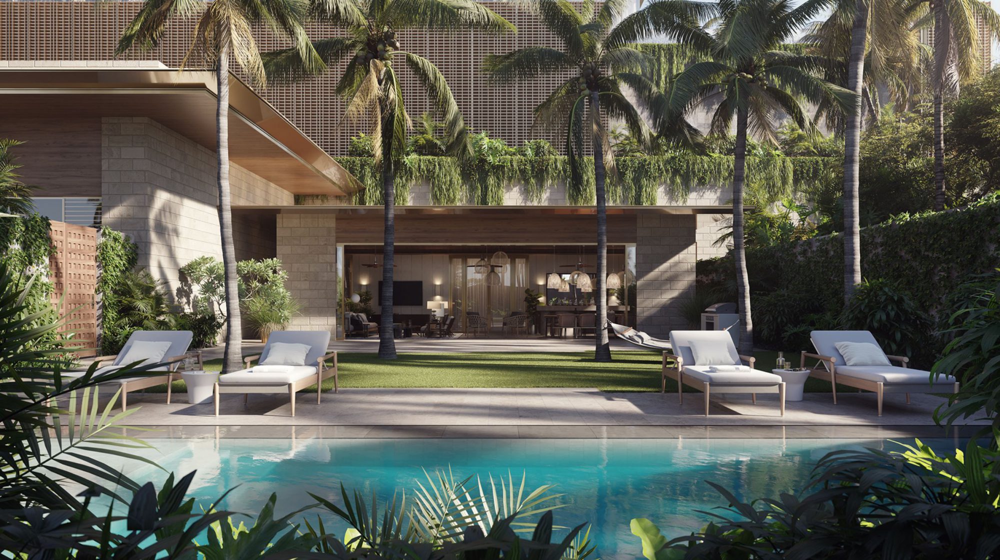 Exterior of the Lauhala Pool House, featuring a pool, poolside seating, and an a indoor-outdoor gathering space