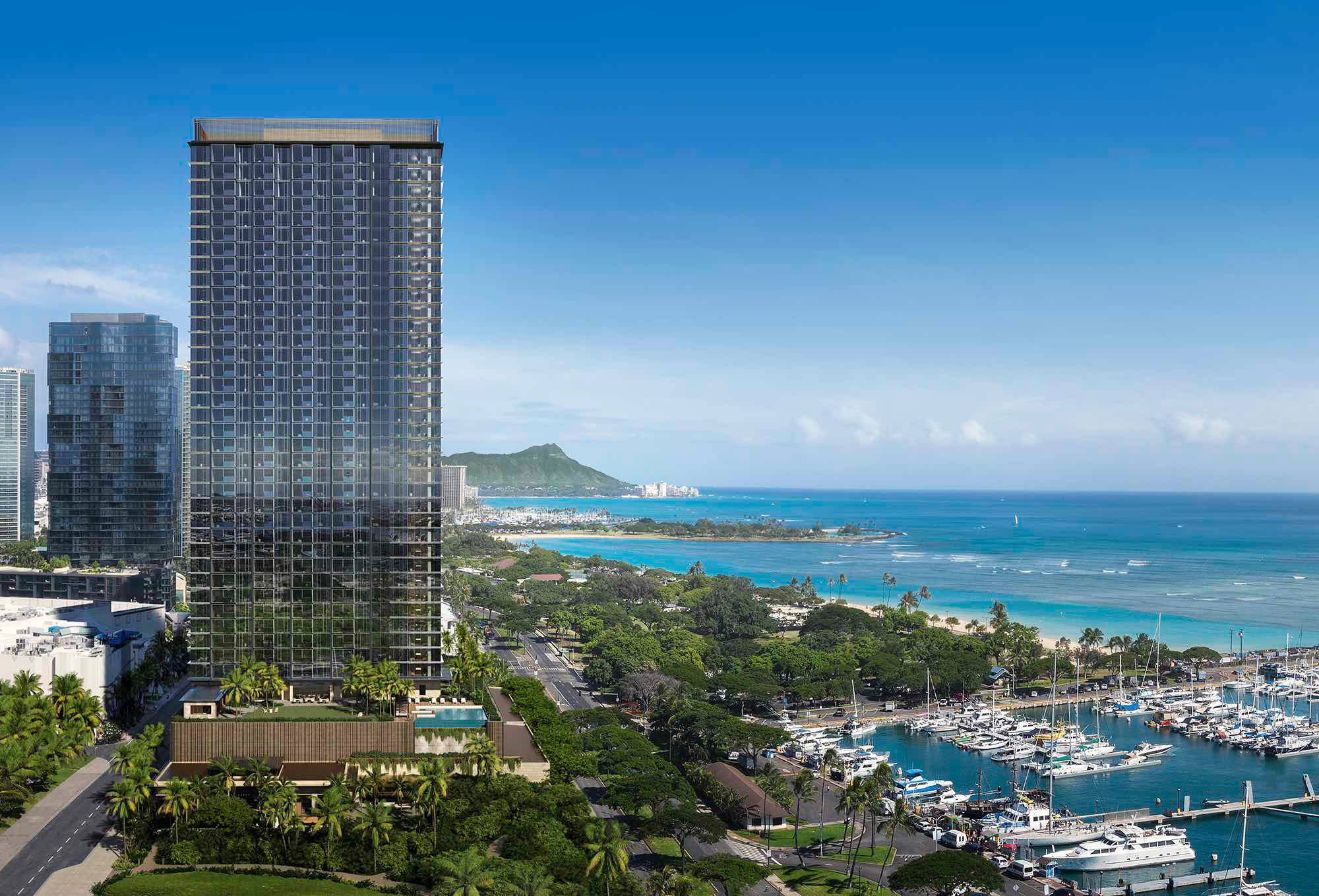 Aerial image of Victoria Place tower overlooking Kewalo Harbor, Ala Moana Beach Park, and Magic Island, with Waikiki and Diamond Head in the distance.