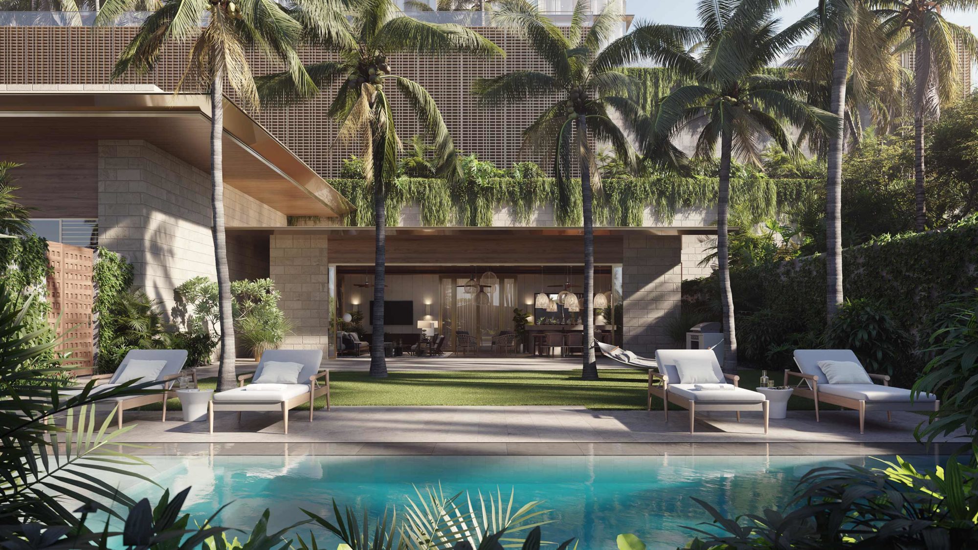 Exterior of the Lauhala Pool House, featuring a pool, poolside seating, and an a indoor-outdoor gathering space